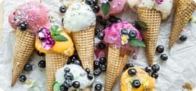 
          lots of ice cream cones with blueberries
