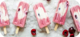 a lot of pink ice cream on the shelf